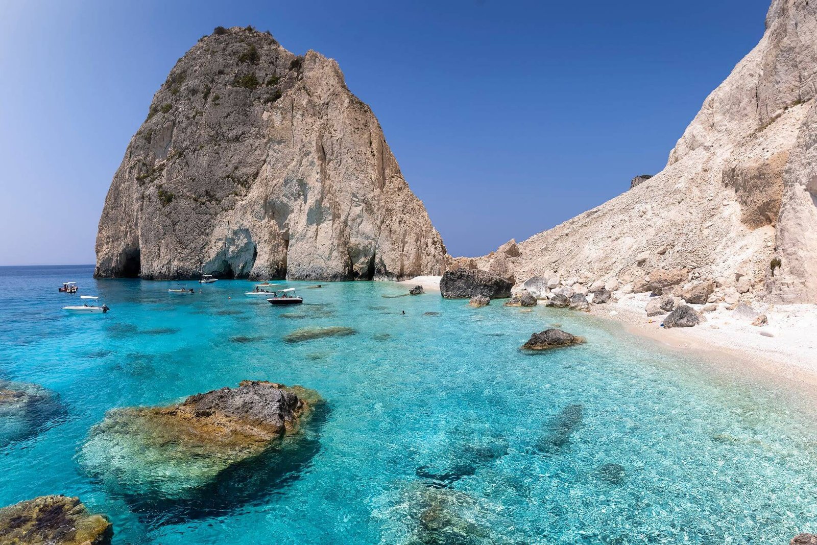 Neon blue electric waters of Mizithres bay Zakynthos